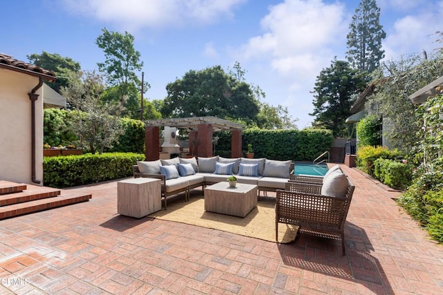 view of patio with a pergola and an outdoor living space