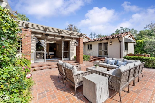 view of patio with an outbuilding, a pergola, and an outdoor hangout area