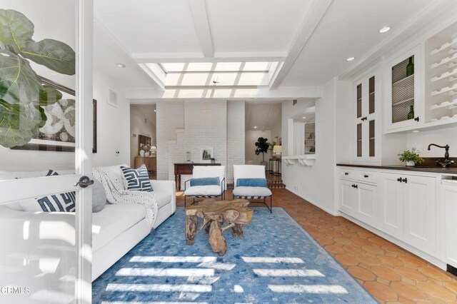 living area with light tile patterned floors and recessed lighting