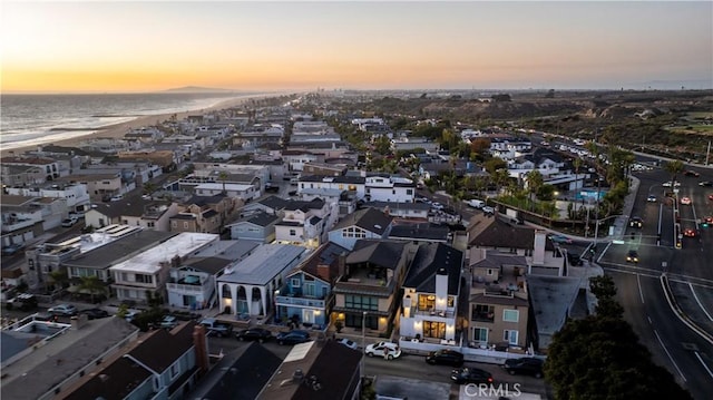 drone / aerial view featuring a residential view and a water view