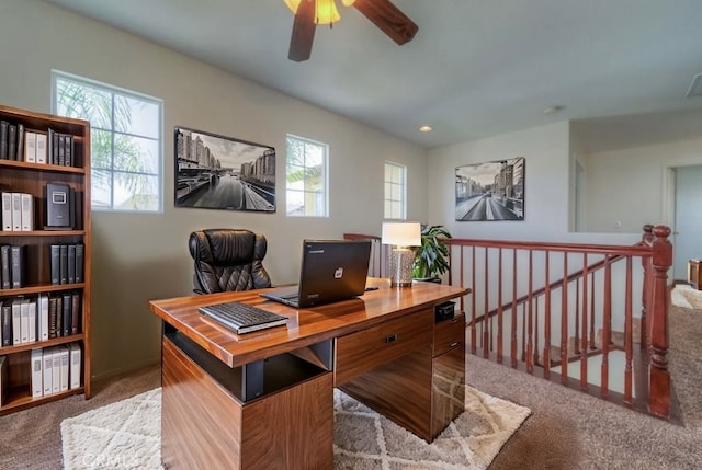office with ceiling fan, carpet floors, visible vents, and plenty of natural light
