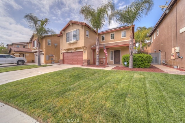 mediterranean / spanish-style house featuring fence, a front lawn, stucco siding, an attached garage, and concrete driveway