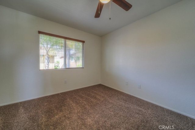 unfurnished room featuring ceiling fan, carpet floors, and baseboards