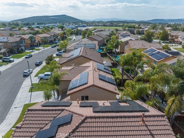 birds eye view of property with a mountain view and a residential view