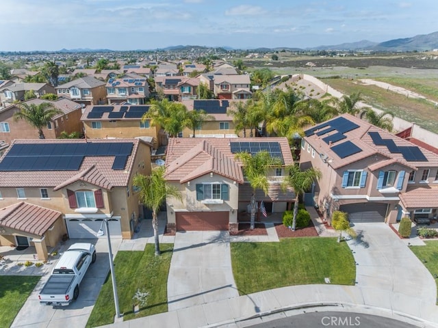 birds eye view of property with a mountain view and a residential view