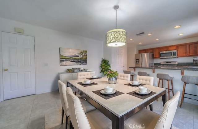 dining room featuring light tile patterned floors, visible vents, and recessed lighting