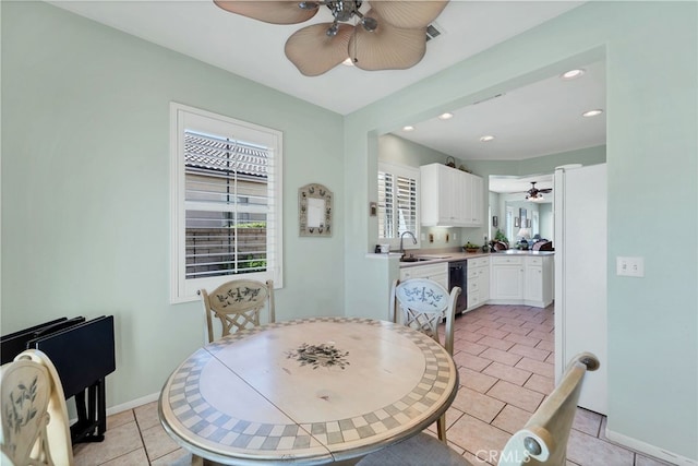 dining room with light tile patterned floors, baseboards, ceiling fan, and recessed lighting