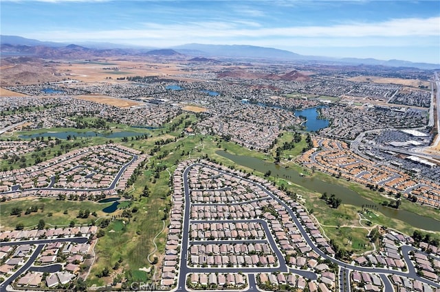 aerial view featuring a water and mountain view and a residential view