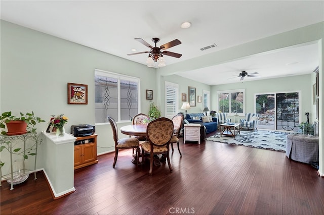 dining area with baseboards, a ceiling fan, dark wood-style flooring, and visible vents