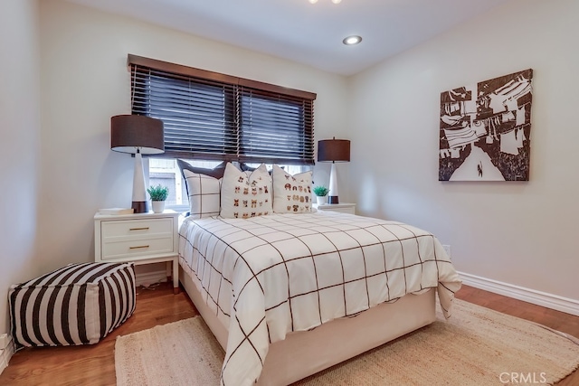 bedroom featuring recessed lighting, light wood finished floors, and baseboards