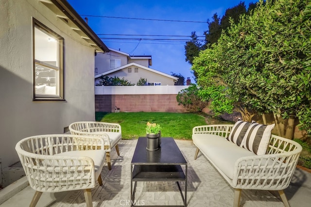 view of patio / terrace with fence and an outdoor living space