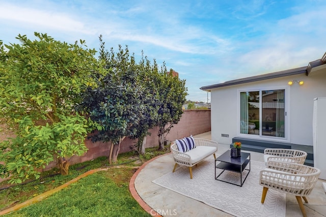 view of patio with a fenced backyard and outdoor lounge area