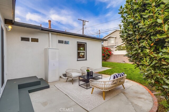 view of patio / terrace featuring fence