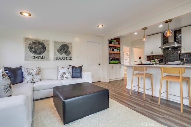living room featuring recessed lighting and light wood-type flooring