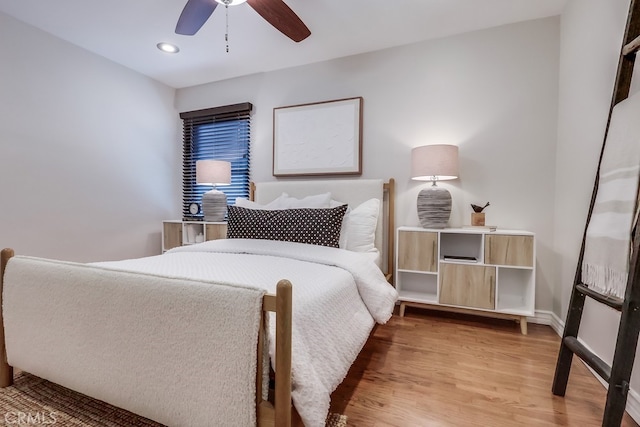 bedroom featuring recessed lighting, wood finished floors, baseboards, and ceiling fan