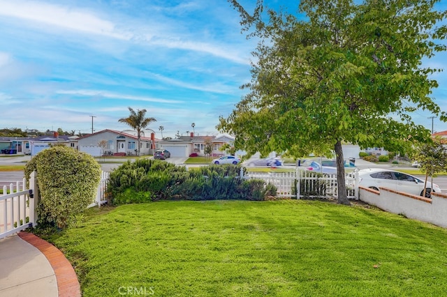 view of yard with a residential view and fence