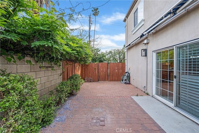 view of patio featuring fence