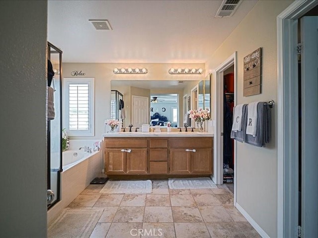 37192 Amateur Way, Beaumont, CA 92223 - bathroom with a bath, a sink, visible vents, and double vanity