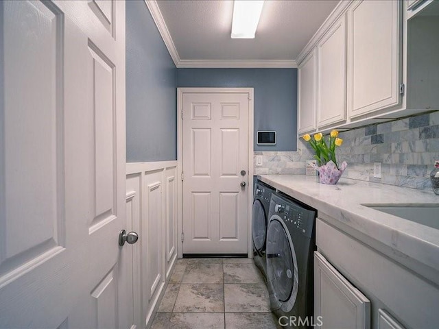 37192 Amateur Way, Beaumont, CA 92223 - laundry area featuring washing machine and dryer, crown molding, and cabinet space