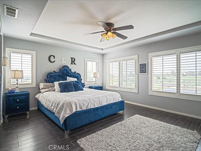 37192 Amateur Way, Beaumont, CA 92223 - bedroom with dark wood finished floors, a raised ceiling, visible vents, baseboards, and ceiling fan