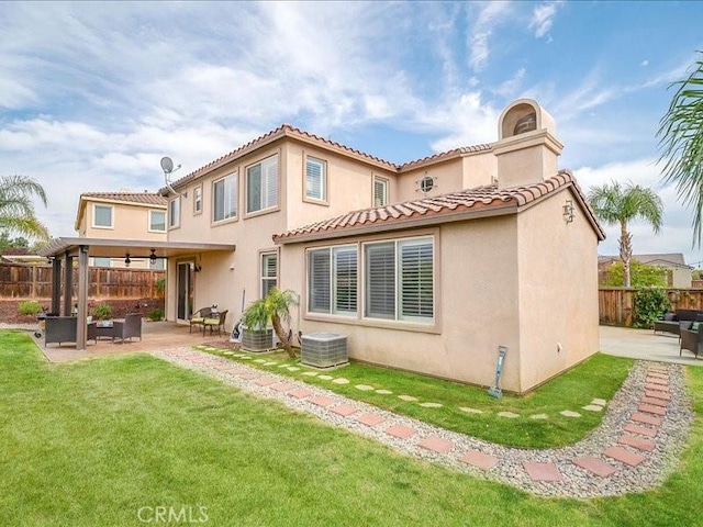 37192 Amateur Way, Beaumont, CA 92223 - back of property with a tiled roof, fence, a yard, a patio, and stucco siding