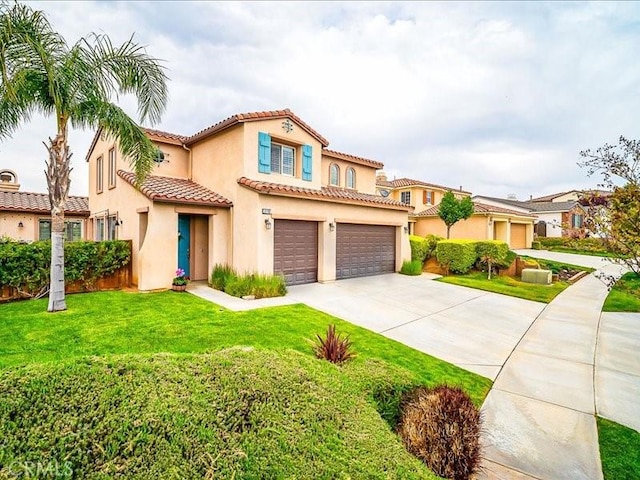 37192 Amateur Way, Beaumont, CA 92223 - mediterranean / spanish house with a front lawn, a tiled roof, driveway, a garage, and stucco siding