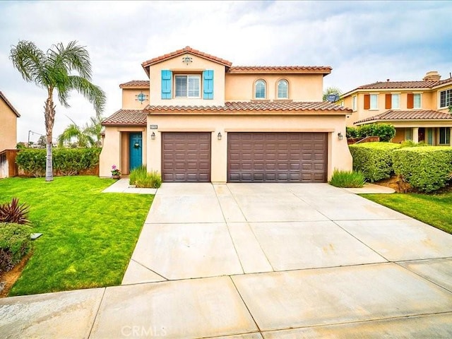37192 Amateur Way, Beaumont, CA 92223 - mediterranean / spanish-style house with a front lawn, stucco siding, an attached garage, a tile roof, and driveway