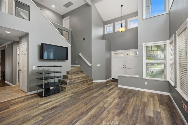 4 Chisholm Trl, Trabuco Canyon, CA 92679 - foyer entrance featuring a towering ceiling, stairway, wood finished floors, and baseboards