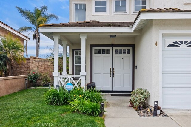 4 Chisholm Trl, Trabuco Canyon, CA 92679 - entrance to property featuring stucco siding, a porch, and a garage