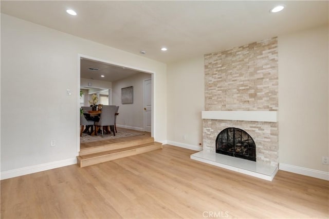 living area featuring wood finished floors and baseboards