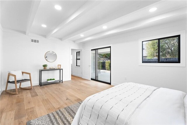 bedroom with light wood-type flooring, baseboards, visible vents, recessed lighting, and beamed ceiling