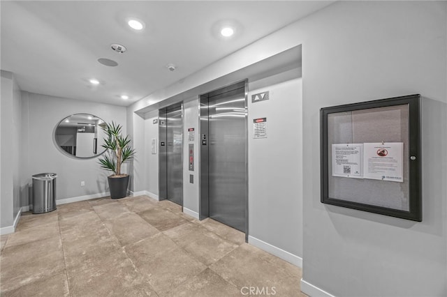 3713 Rivington, Irvine, CA 92612 - hall with recessed lighting, baseboards, and elevator