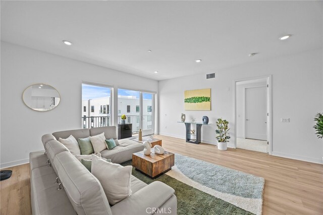 3713 Rivington, Irvine, CA 92612 - living room with visible vents, recessed lighting, light wood finished floors, and baseboards
