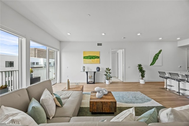 3713 Rivington, Irvine, CA 92612 - living room featuring recessed lighting, baseboards, visible vents, and wood finished floors