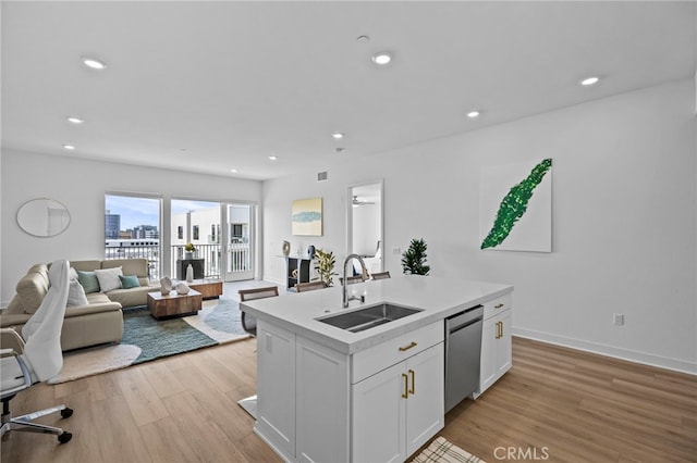 3713 Rivington, Irvine, CA 92612 - kitchen featuring light countertops, a sink, light wood finished floors, and dishwasher