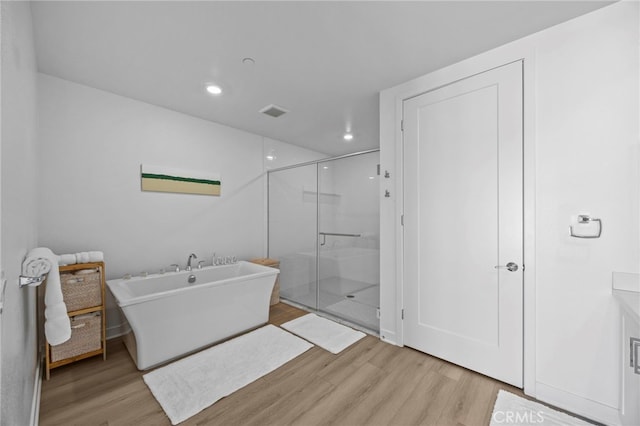 3713 Rivington, Irvine, CA 92612 - full bath featuring visible vents, a shower stall, wood finished floors, a soaking tub, and recessed lighting