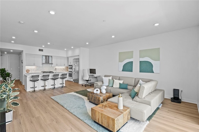 3713 Rivington, Irvine, CA 92612 - living area with light wood-type flooring, recessed lighting, baseboards, and visible vents