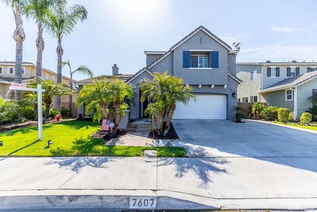 7607 Corona Valley Ave, Eastvale, CA 92880 - traditional-style house with a garage, driveway, a front lawn, and stucco siding