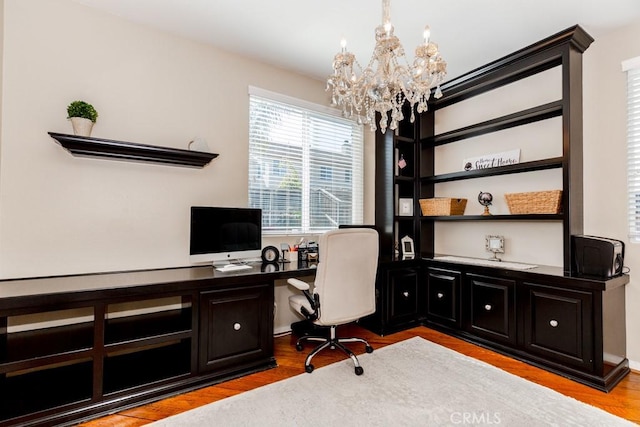 7607 Corona Valley Ave, Eastvale, CA 92880 - office area with a chandelier and wood finished floors
