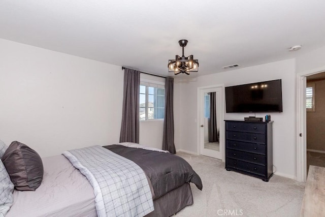 7607 Corona Valley Ave, Eastvale, CA 92880 - bedroom with a chandelier, light carpet, and baseboards