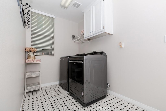 7607 Corona Valley Ave, Eastvale, CA 92880 - washroom with cabinet space, washing machine and clothes dryer, and baseboards