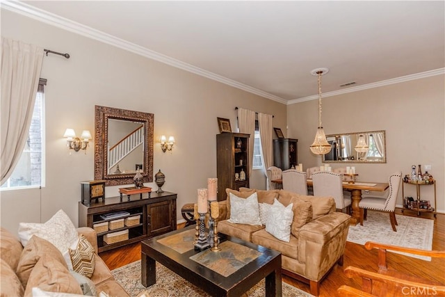 7607 Corona Valley Ave, Eastvale, CA 92880 - living room featuring wood finished floors, crown molding, and baseboards