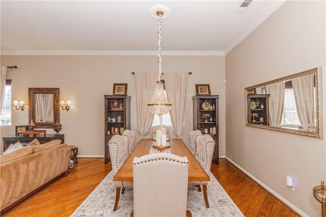 7607 Corona Valley Ave, Eastvale, CA 92880 - dining space with ornamental molding, wood finished floors, and baseboards