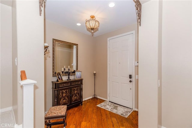 7607 Corona Valley Ave, Eastvale, CA 92880 - foyer entrance with wood-type flooring, baseboards, recessed lighting, and a chandelier