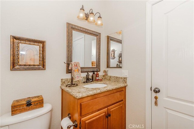 7607 Corona Valley Ave, Eastvale, CA 92880 - half bathroom with toilet and vanity