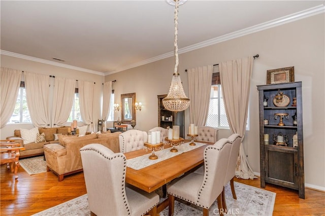 7607 Corona Valley Ave, Eastvale, CA 92880 - dining room featuring crown molding and light wood-style floors