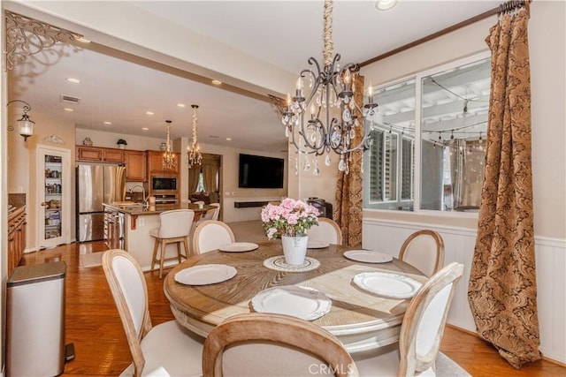 7607 Corona Valley Ave, Eastvale, CA 92880 - dining room with a chandelier, light wood finished floors, and recessed lighting