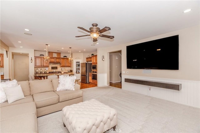 7607 Corona Valley Ave, Eastvale, CA 92880 - living area featuring a ceiling fan, recessed lighting, and wainscoting