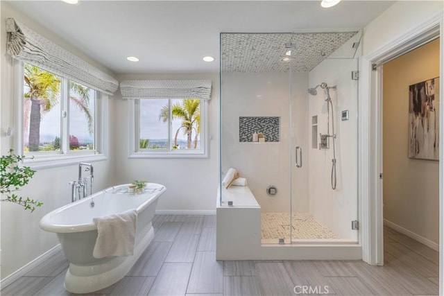 3802 E Summitridge Ln, Orange, CA 92867 - bathroom with recessed lighting, baseboards, a freestanding bath, and a shower stall