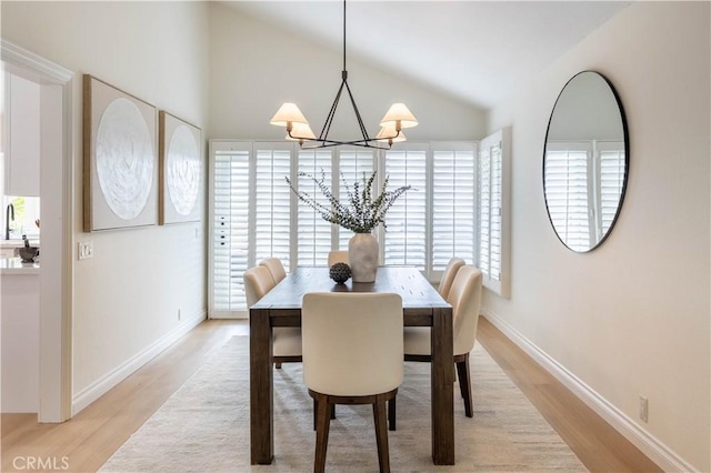 3802 E Summitridge Ln, Orange, CA 92867 - dining room featuring an inviting chandelier, lofted ceiling, light wood-style flooring, and a wealth of natural light
